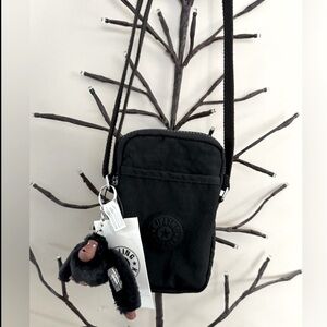 Brand new “Kipling”mini crossbody bag for women.Size-w5”x7”inc.Color-black tonal